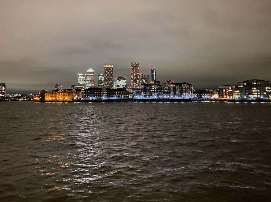 A photo of Canary Wharf at night