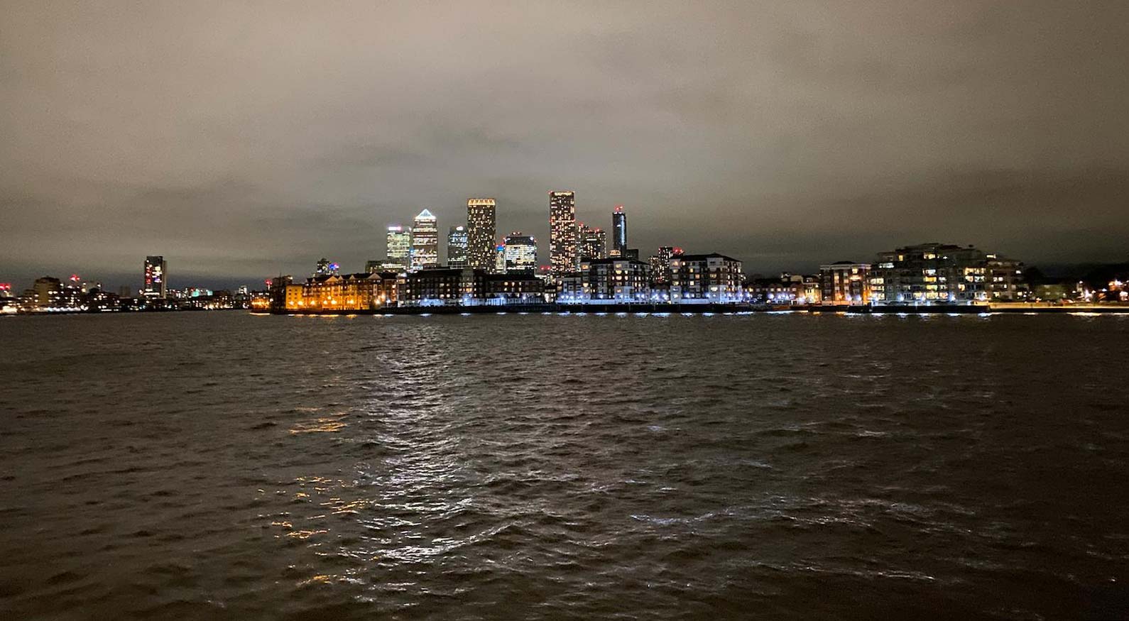 A photo of Canary Wharf at night